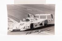 PORSCHE 936/81 VERN SCHUPPAN: A signed black and white photo, showing Vern Schuppan in action at the 1981 Le Mans 24 hour race, this car finished in 12th place, co drivers Mass - Haywood