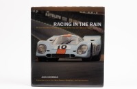 RACING IN THE RAIN:&nbsp;A signed copy of "Racing in the rain", my years with brilliant drivers, legendary sports cars, and a dedicated team, personally signed by Vic Elford in a black marker pen, by John Horsman, forewords by Jacky Ickx, brian Redman, Derek B
