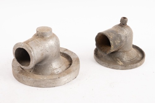 BUGATTI: Two Bugatti Type 37 water pump covers, one original (possibly modified) and one in un-machined casting condition [Location: Melbourne]