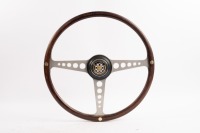 JAGUAR: A Jaguar E-Type steering wheel, three spoke, wooden rim, 42cm wide [Location: Melbourne]