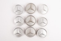 MERCEDES-BENZ: A group of assorted Mercedes-Benz centre wheel caps, visible part numbers 2014010225 / 1074000025 [Location: Melbourne]