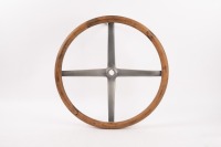 STEERING WHEEL: A circa 1920s four spoke wood rim steering wheel, thought to possibly suit Dodge, [P/N 18866], 43cm wide [Location: Melbourne]