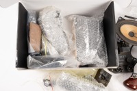 MERCEDES-BENZ: A group of assorted parts for W126 and W123 mostly being interior parts, includes items such as two W126 Burl gearshift knobs, W126 NOS Distributor seal Part No A0149975848, M103 ignition module, and others [Location: Melbourne] - 5