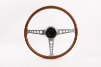 STEERING WHEEL: A three spoke wood rim steering wheel, believed to made by MCA (Australia), circa early 1960s, 41cm wide [Location: Melbourne]
