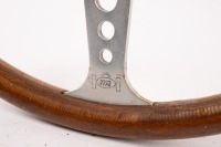 STEERING WHEEL: A three spoke wood rim steering wheel, believed to made by MCA (Australia), circa early 1960s, 41cm wide [Location: Melbourne] - 2