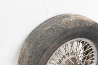 WIRE WHEEL: A wire wheel with Dunlop tyre, size 14 inch [Location: Melbourne] - 2