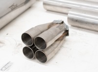 BURNS STAINLESS: Four individual Burns Stainless muffler pieces and two RathGibson steel tube pieces [Location: Melbourne] - 2