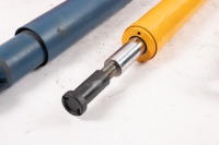 KONI: A Koni shock absorber [P/N 8611 1257SPORT] plus also two made in England shock absorbers, manufacturer unknown [P/N 501445] [Location: Melbourne] - 2