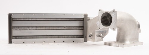 INTERCOOLER: A NOS three core intercooler, manufacturer unknown, comes also with machined manifold piece (written 'ATTN John Lawrence) [Location: Melbourne]