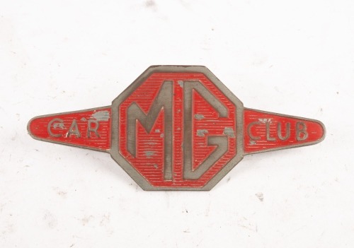 MG: An early rare MG Car Club grille badge, red with horizontal ribs, 6.5cm high, 16cm wide [Location: Melbourne]