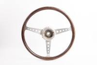 STEERING WHEEL: A three spoke wood rim steering wheel, 38cm wide [Location: Melbourne]
