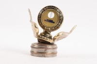 BOYCE MOTOMETER: A reproduced winged radiator cap with attached Boyce Motometer, 12cm high, 12cm wide [Location: Melbourne]