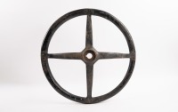 STEERING WHEEL: An early four spoke steering wheel, wooden rim, 43cm wide [Location: Melbourne] - 2
