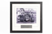 BT26: A impressive b/w photograph of the BT26 Repco with 'bi hi' wings during the 1968 Canadian G.P, hand signed by Sir Jack and Ron Tauranac, image 19.5cm high, 24.5cm wide