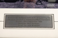 BT26: A impressive b/w photograph of the BT26 Repco with 'bi hi' wings during the 1968 Canadian G.P, hand signed by Sir Jack and Ron Tauranac, image 19.5cm high, 24.5cm wide - 2