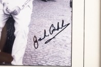 BT19: A b/w photograph featuring Sir Jack in a European pits with his BT19, hand signed by Sir Jack, image 19cm high, 25.5cm wide - 2