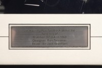 BT26A: A photograph featuring Sir Jack sitting in a BT26A in 1969 giving Ron Tauranac feedback, hand signed by Sir Jack and Ron Tauranac, framed and glazed, image 19cm high, 25cm wide - 2