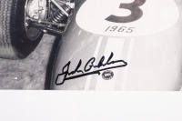 HILL: A B/W photograph featuring Sir Jack & Graham Hill at a launch event for the Formula 3 1965 Repco-Brabham, signed in black marker Jack Brabham & Ron Tauranac - 2
