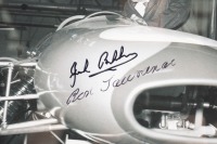 JACK BRABHAM: A B/W photograph featuring Sir Jack standing over a Brabham racing car, signed in black marker Jack Brabham & Ron Tauranac - 2