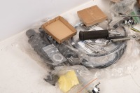 NORTON: A group of assorted new Norton parts, includes badges, stickers, sprocket, valves, cables and cylinder head stud mount kit - 2