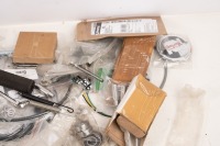 NORTON: A group of assorted new Norton parts, includes badges, stickers, sprocket, valves, cables and cylinder head stud mount kit - 3