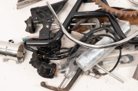 AUTOJUMBLE: A group of assorted vintage parts, includes a seat cover, universal sprocket, switches, new baffle, new centre stand, grab rail etc - 2