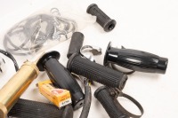 AUTOJUMBLE: A group of assorted parts, includes new side stand mount bracket, switch block, assorted rubbers, etc - 2