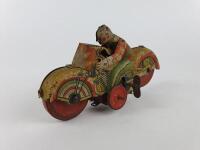 NOVELTY: Mettoy UK Clown on bike c1950s. - 2