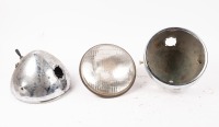 LUCAS: Two Lucas headlamp buckets with headlamp rim & reflector