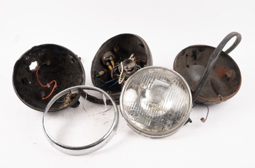 HEADLAMPS: A group of assorted headlamp buckets, one rim and one reflector