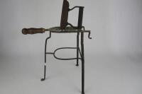 IRON: An antique cast iron and brass trivet