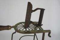 IRON: An antique cast iron and brass trivet - 2
