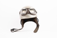 HELMET: A circa 1950s Cromwell 'pudding basin' helmet with goggles, with Norton sticker to front