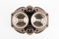 A Triumph Twin 650cc reconditioned cylinder block with new pistons, minor shelf ware