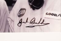 HULME: A framed black and white photograph featuring Denny Hulme and Jack Brabham, photograph hand signed by Brabham, framed and glazed, 35.5cm high, 40cm wide overall - 3