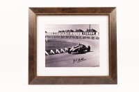 COOPER T51: A framed and glazed black and white photograph featuring Jack Brabham's Cooper T51 1959 Formula 1 World Championship car, photo hand signed by Jack Brabham