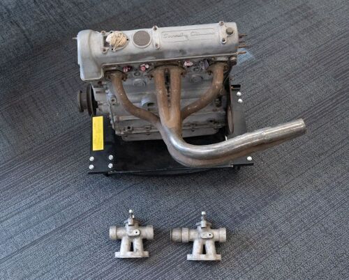 ENGINE: A Coventry Climax four cylinder 1500cc FWB SOHC engine as used in Lotus Elites & Cooper T43, engine number 'FWB400-3812743', together with exhaust and carburettor manifolds