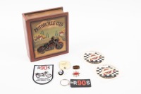MOTORCYCLE TRINKETS: A small group of motorcycle related trinkets, including a Vincent HRD badge, a BSA badge, a group of BMW items, American Historic Racing Motorcycle Association stickers, all stored within modern timber 'Motorcycle Club' box.