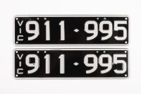 NUMBER PLATES: A set of Victorian number plates '911.995', slimline size, white lettering on black background, sold with rights to display