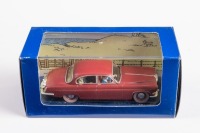 TINTIN: A 1:43 scale Moulinsart 1962 Jaguar MkX model, this is La Jaguar du Docteur Muller, finished in dark red paintwork as per the comic TINTIN, model number 2 118 040
