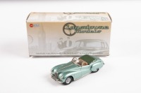 ASTON MARTIN: A high-quality 1:43 scale white metal model of a 1948 Aston Martin DB 1 in green metallic, within box