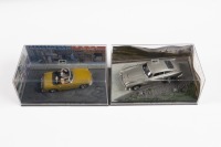 JAMES BOND: A pair of 1:43 scale models, an Aston Martin DB5 from Goldfinger, also an MGB from The man with the Golden Gun - 2