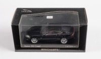 JAGUAR: A Minichamps 1:43 scale 2006 Jaguar XK coupe in black, limited edition of 2016 units in original box