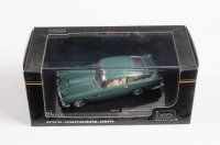 DB4: A 1:43 scale IXO Models 1958 Aston Martin DB4 Coupe in green, within box