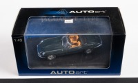 JAGUAR: A 1:43 scale Autoart Jaguar Series III V12 E Type Roadster in dark green with tan interior