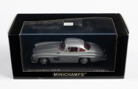 MERCEDES-BENZ: A Minichamps 1:43 scale 1955 Mercedes-Benz 300 SL in silver, limited edition of 5040 units in original box