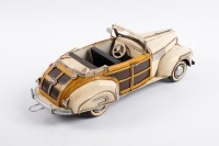 BUICK: A Retro Delights handmade tin 1941 Buick Woody convertible model, 37cm long - 2