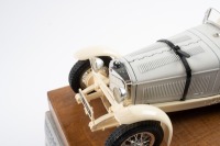 MERCEDES-BENZ: A Bburago 1:18 scale 1931 Mercedes-Benz SSKL in white, presented fixed on timber base with nameplate in original box - 2