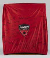 DUCATI: A Desmosedici bike cover signed by Ducati race team