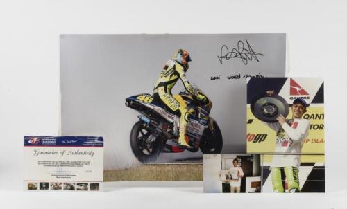 ROSSI: A large 2001 World Champion photograph of Valentino Rossi. Signed by Rossi. L.E 3/46
